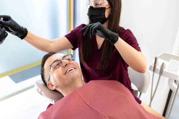 How A Restorative Dentist Helps Rebuild Your Smile